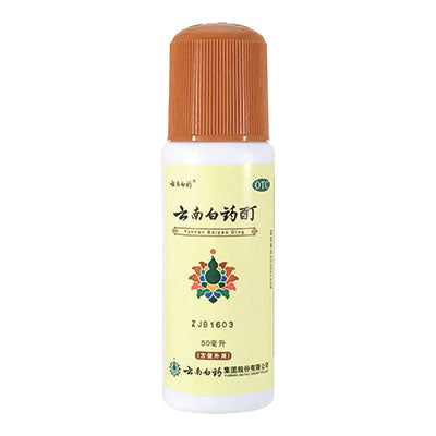 White and cream colored bottle of Yunnan Baiyao Tincture.
