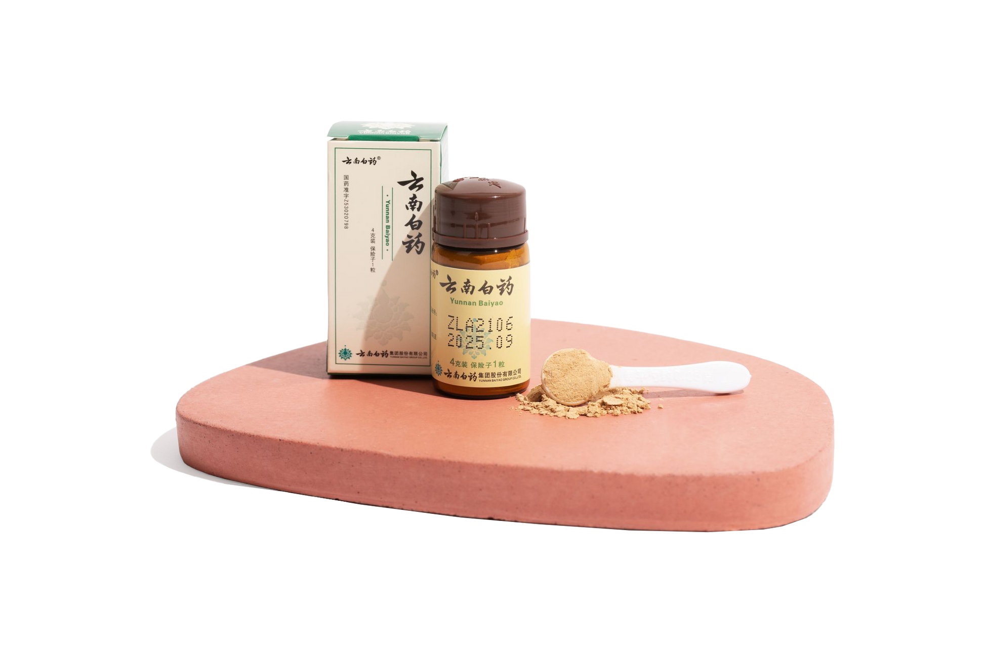 Image of a single bottle of Yunnan Baiyao powder for pets with a spoon of powder sitting on a podium.