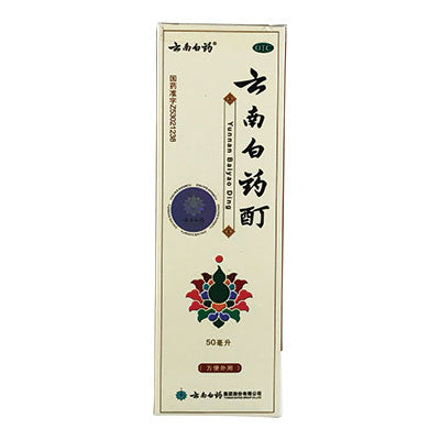 Light cream colored packaging of Yunnan Baiyao Tincture with applicator brush.